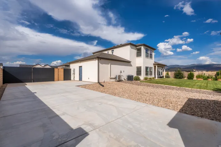 Expansive concrete driveway with a gravel border