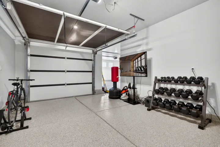 Attached garage with an epoxy-coated floor