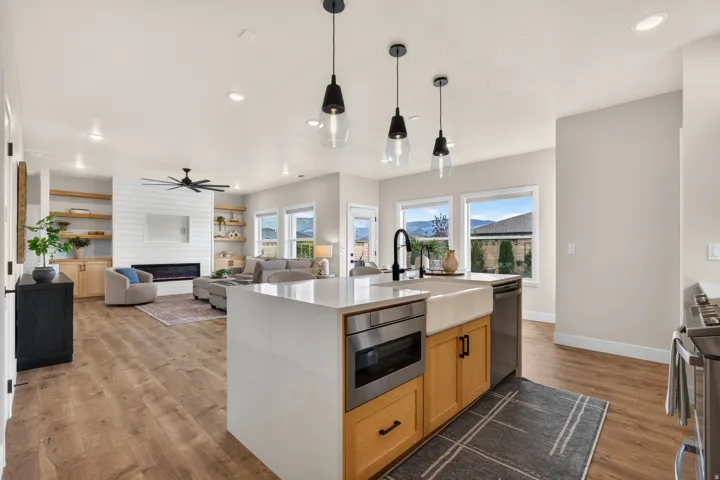 Kitchen island with quartz countertop and farmhouse sink