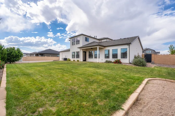 Expansive rear lawn with established landscaping