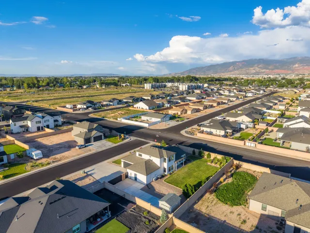 Aerial perspective highlighting a residential neighborhood with mountain scenery