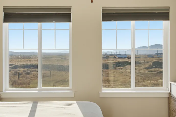 Two large windows with white muntins