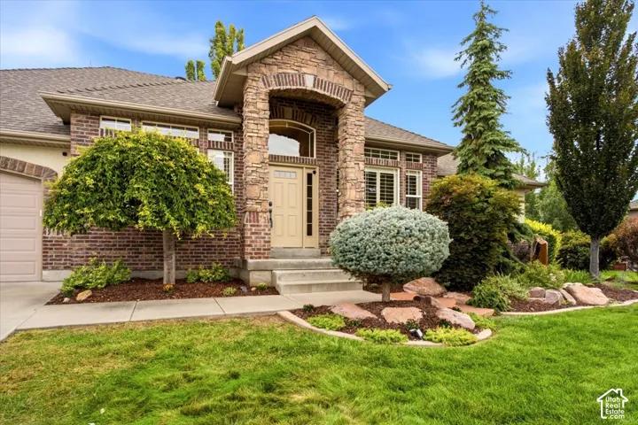 Brick and stone exterior with arched entry