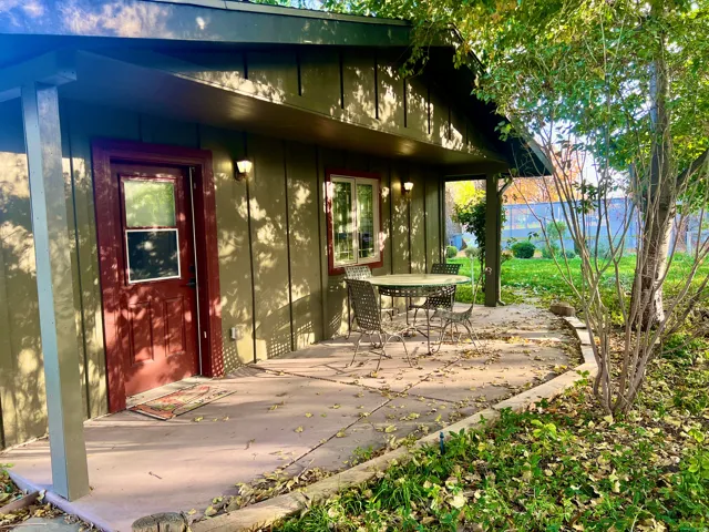 Concrete patio with a covered porch entry