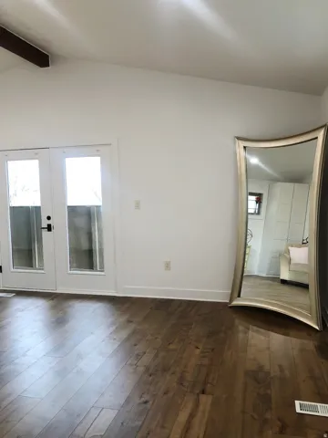 Vaulted ceiling with exposed wood beam
