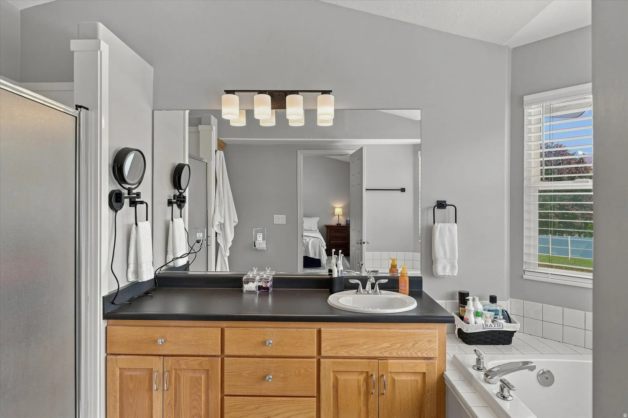 Wood-finish cabinetry with clear knob hardware