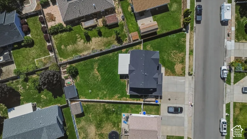 Expansive lot with a spacious backyard, established lawns, and mature trees