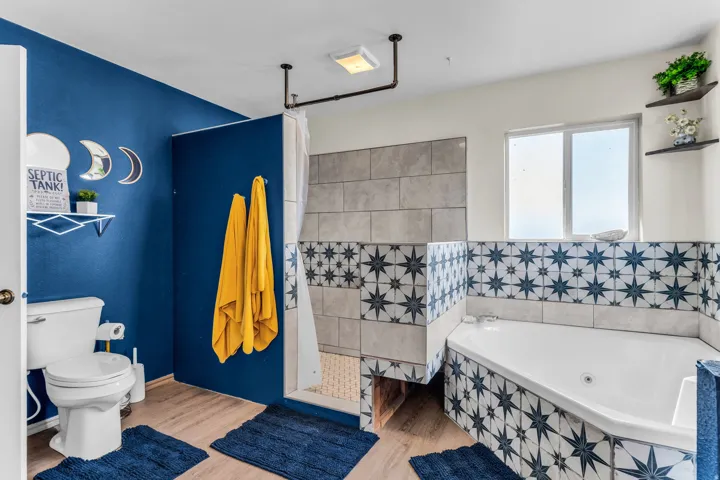 Corner soaking tub with star-patterned tile surround