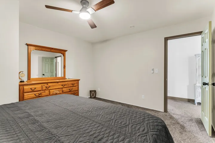 Ceiling fan with wood-finish blades and integrated lighting