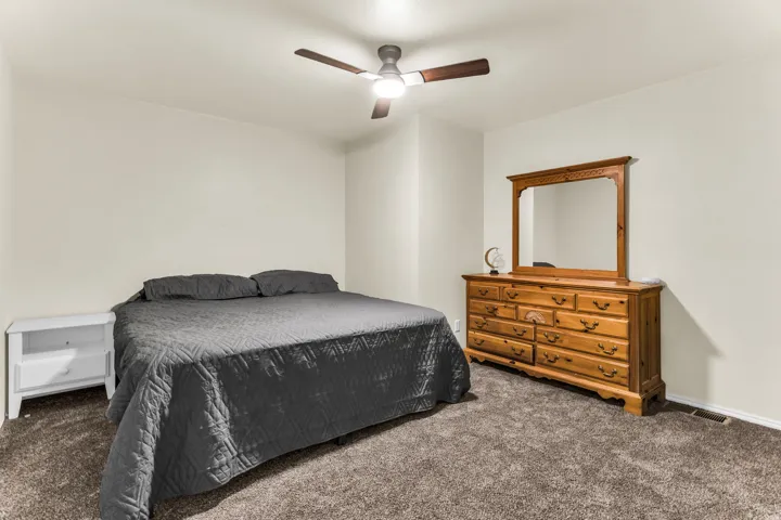 Neutral wall paint and brown tone carpeting