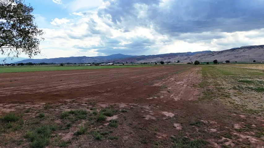Expansive land parcel with distant mountain ranges and varied terrain
