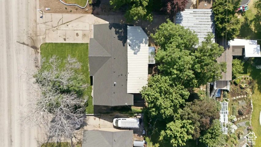 Shingle roof, mature trees, landscaped garden, front lawn, concrete driveway