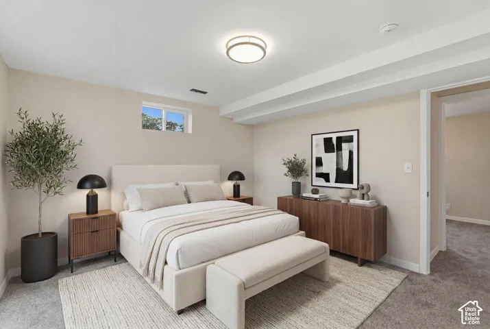 Plush carpeting, recessed ceiling beams, and a window with natural light. Virtually Staged
