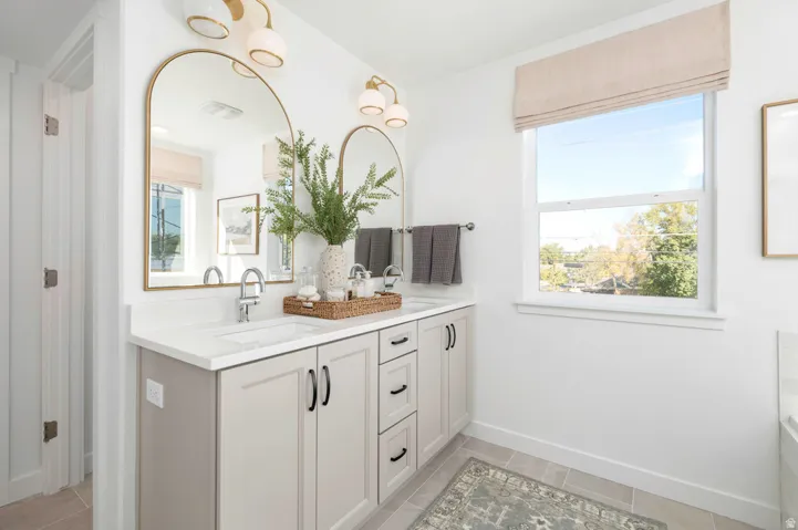 Dual vanity with under-mount sinks and light-toned cabinetry