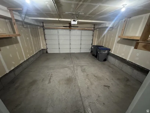2 car garage with overhead shelving