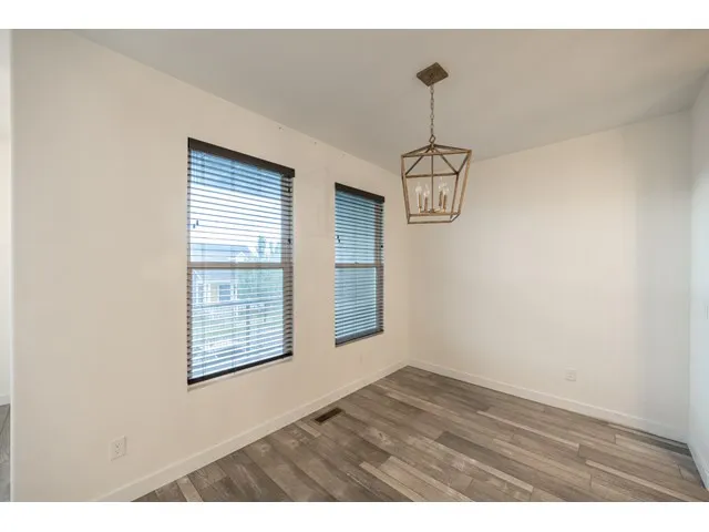 Dining area adjacent to kitchen looks out to the 1st balcony.