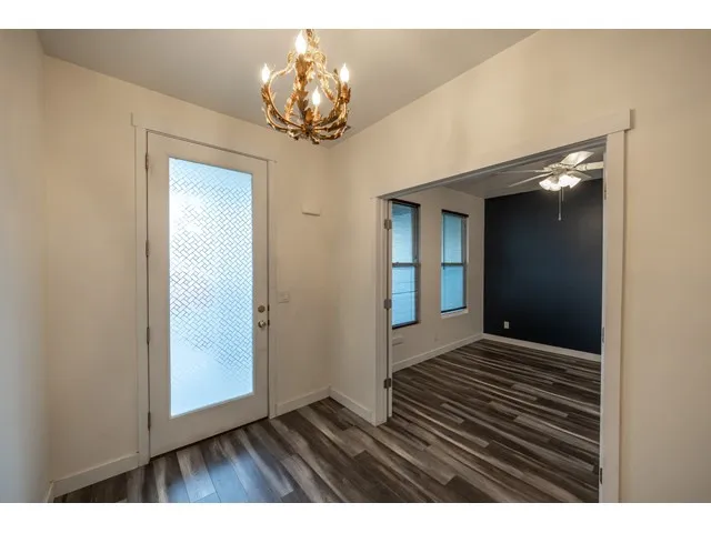 Entry is adjacent to main floor ensuite bath with French doors.