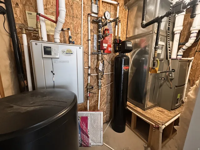 Tankless water heater, water softener system, furnace, and exposed utility piping