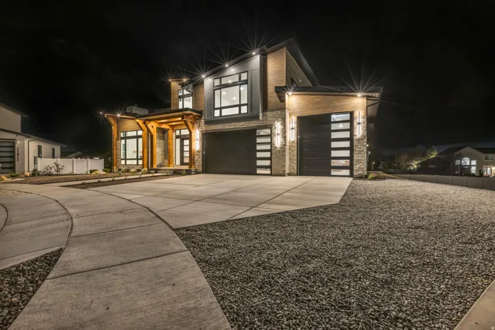 Contemporary exterior featuring stone accents and wood beam details
