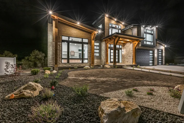 Contemporary exterior with stone cladding and wood-finish accents