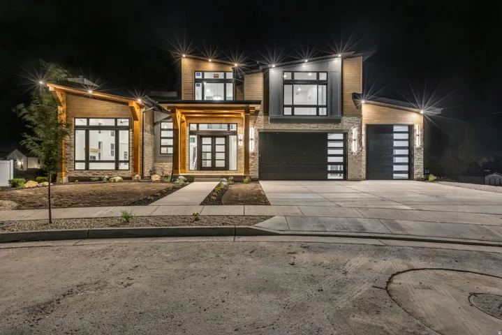 Modern exterior featuring wood paneling and stone accents
