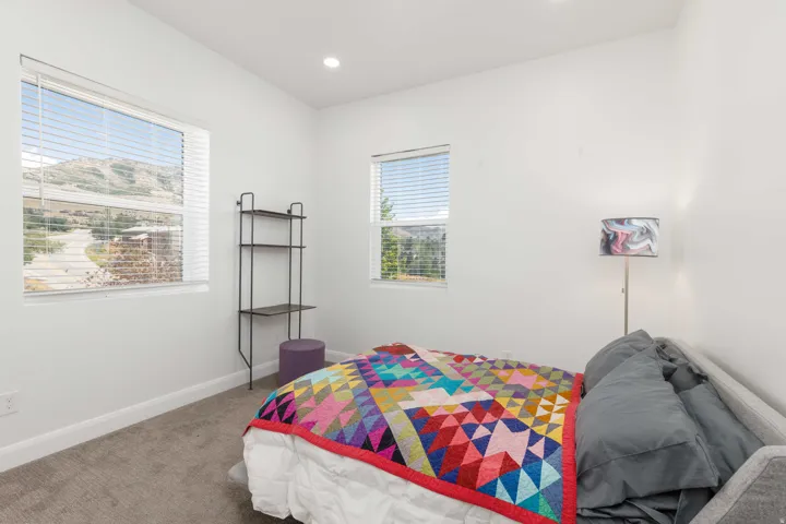 Recessed lighting, large windows, and carpet flooring