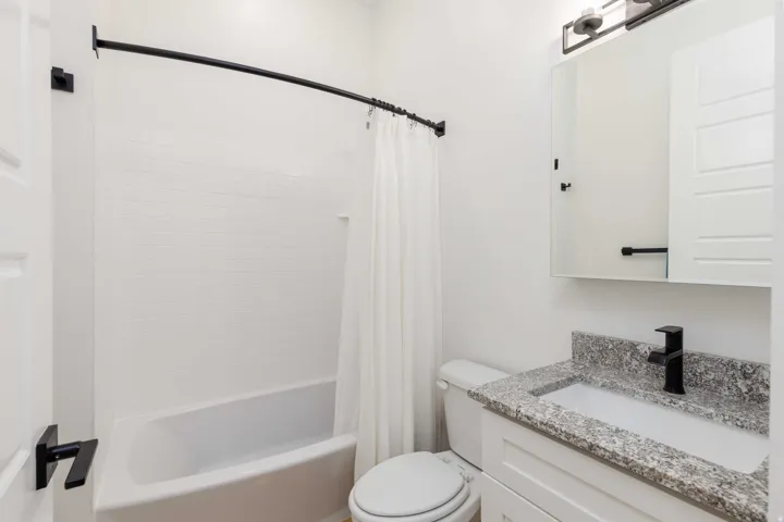 White subway tile bath surround with a shower/tub combination