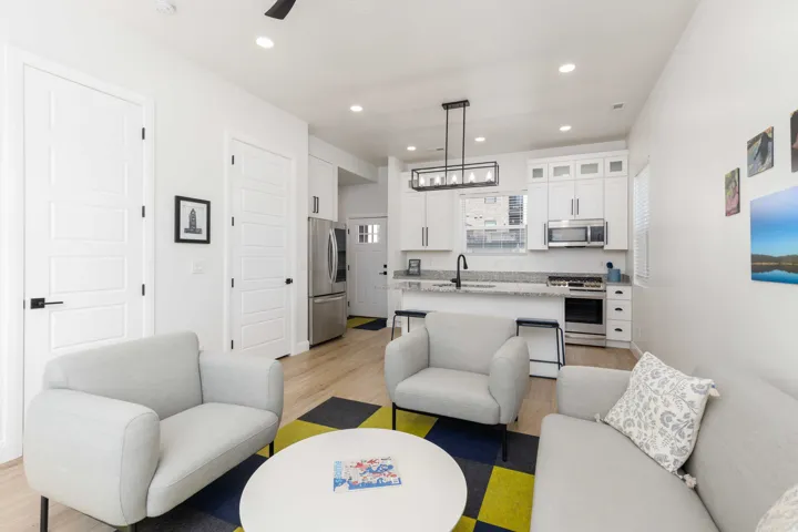Open-concept living area with wood-finish flooring
