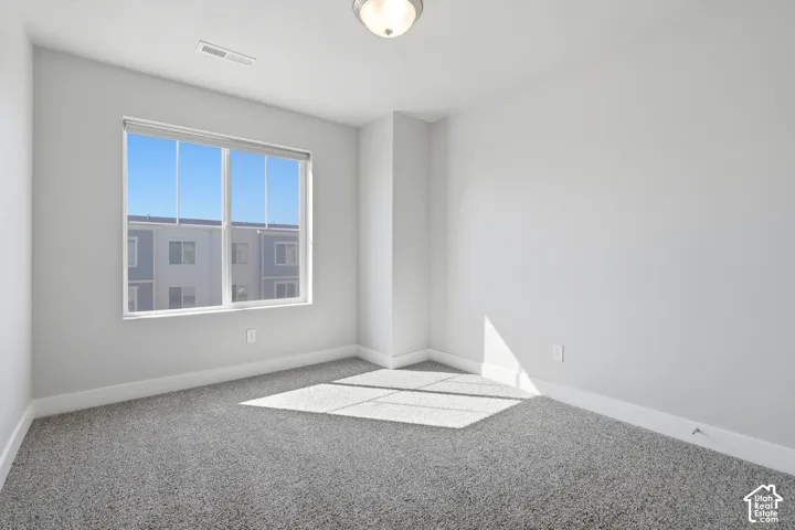 Recessed lighting and carpeted flooring