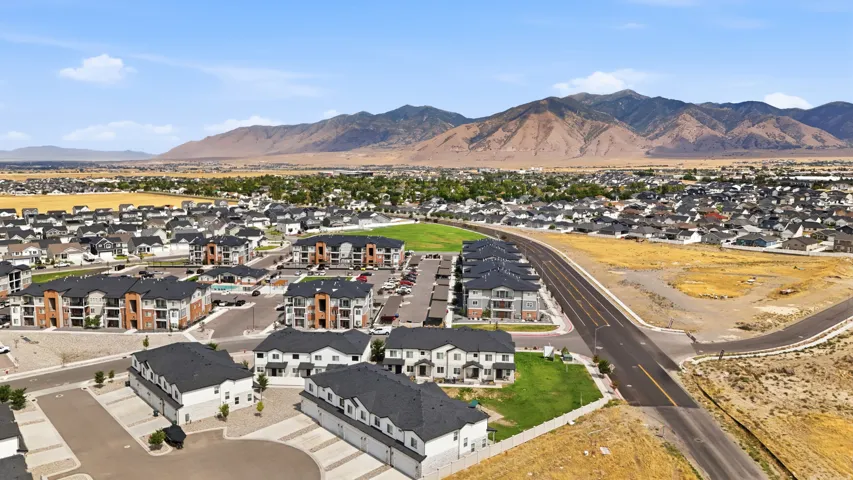 Expansive development featuring a mix of townhomes and multi-story residential buildings