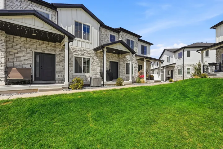 Stone veneer and vertical siding exterior
