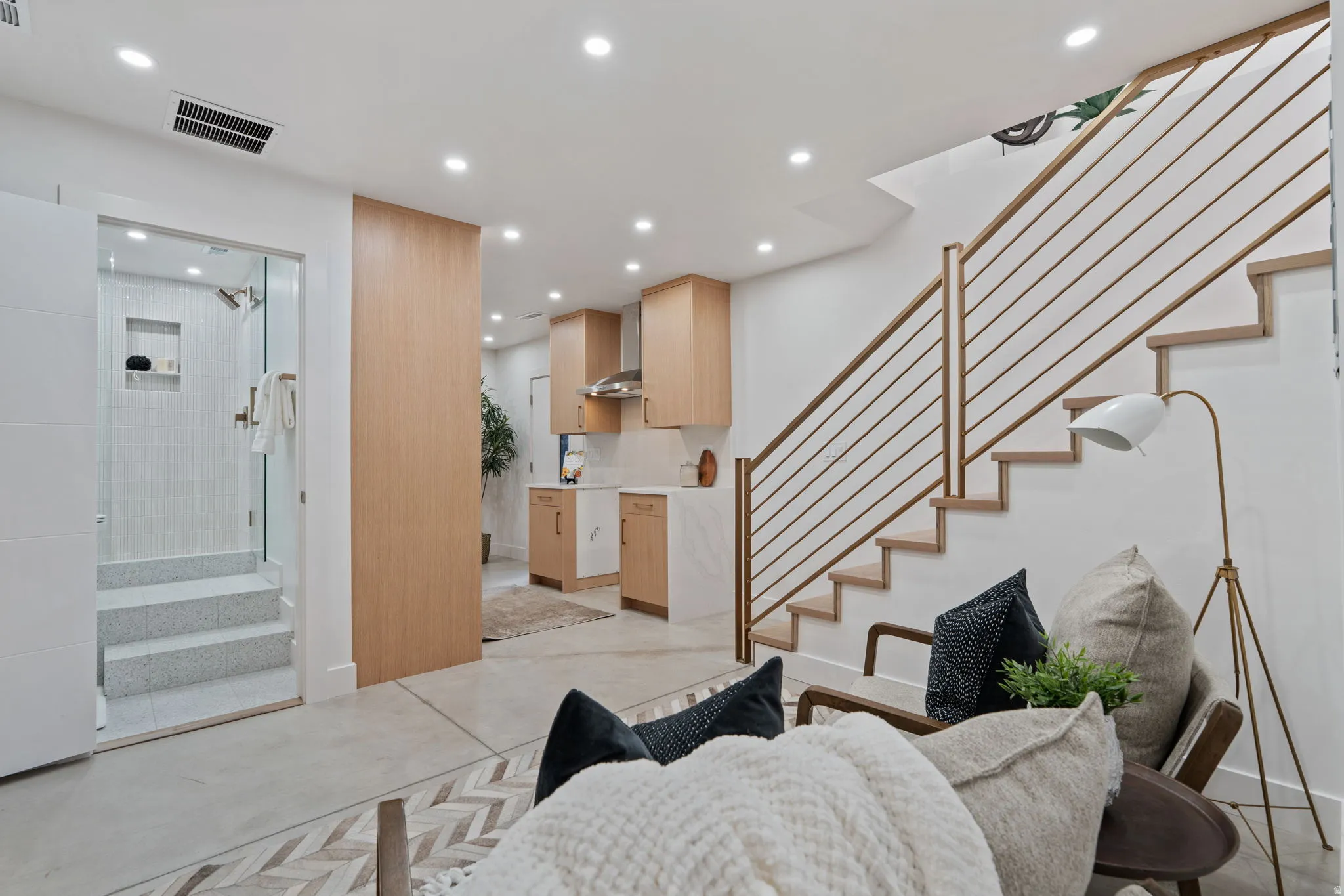 Wood-finish open staircase with metal railings
