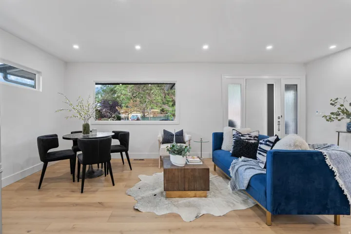 Recessed lighting illuminating wood-finish flooring