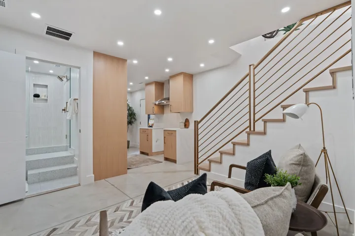 Wood-finish open staircase with metal railings