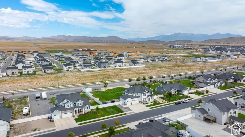 Expansive neighborhood with diverse residential architecture and mountain backdrop