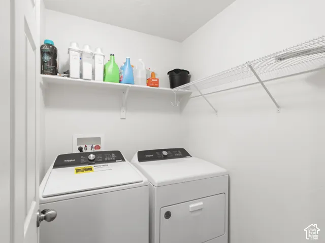 Dedicated laundry space with fixed shelving and a wire rack system
