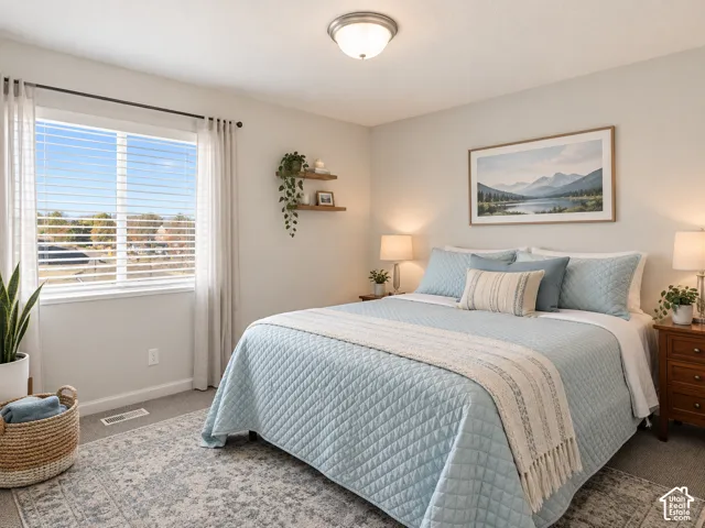 Neutral-toned walls, expansive window with horizontal blinds, and flush-mount ceiling light fixture