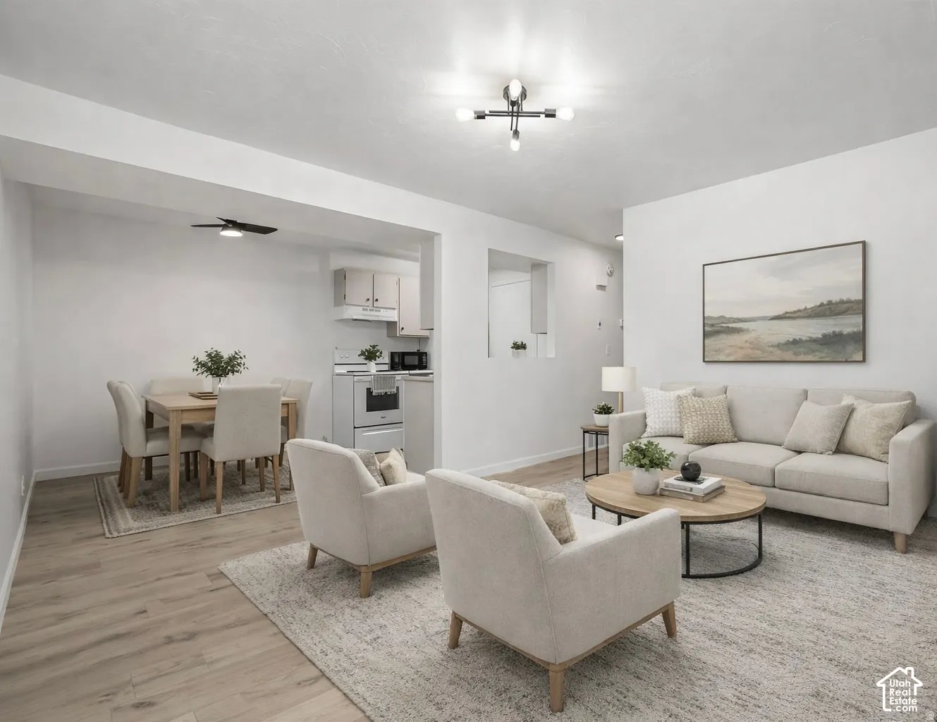 Open-concept living area featuring wood-finish flooring, recessed lighting, and a modern ceiling light fixture