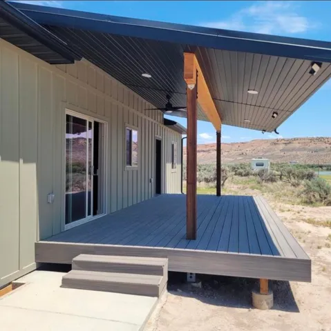 Expansive deck featuring composite decking, a deep overhang, recessed lighting, and a ceiling fan