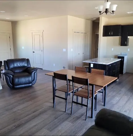 Wood-finish flooring throughout, complemented by light-toned wall paint