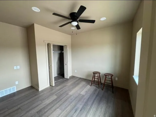 Recessed lighting, wood-finish flooring, ceiling fan, and bi-fold closet doors