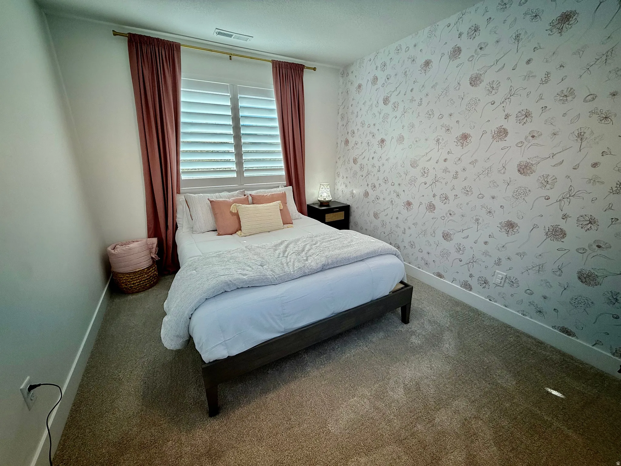 Window with white shutters and curtain rod