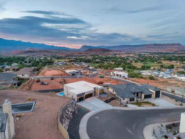New construction residential properties with concrete driveways and multiple garages