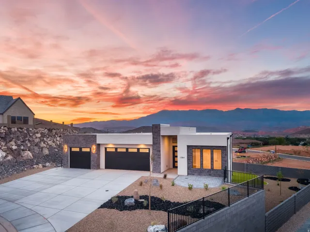 Modern exterior with stone accents and a flat roofline