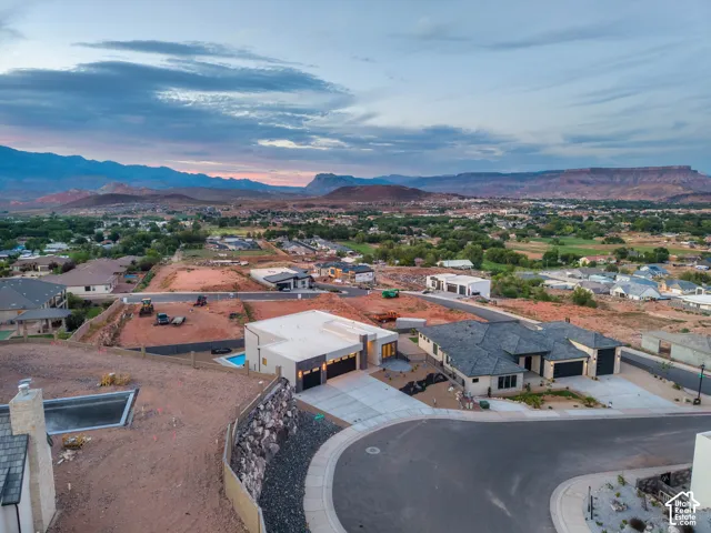 New construction residential properties with concrete driveways and multiple garages