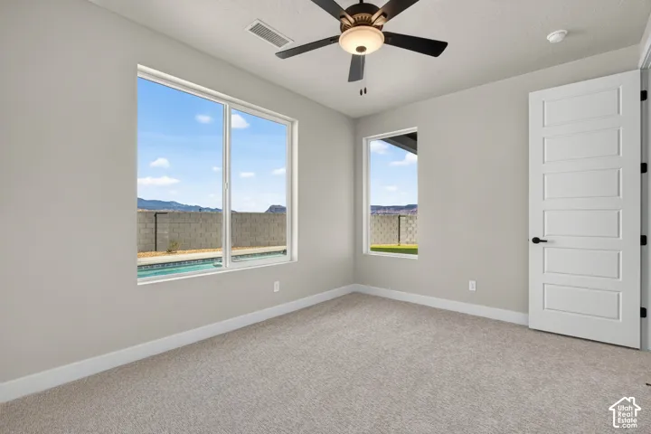 Recessed lighting, ceiling fan with integrated lighting, large window, additional window, modern paneled door