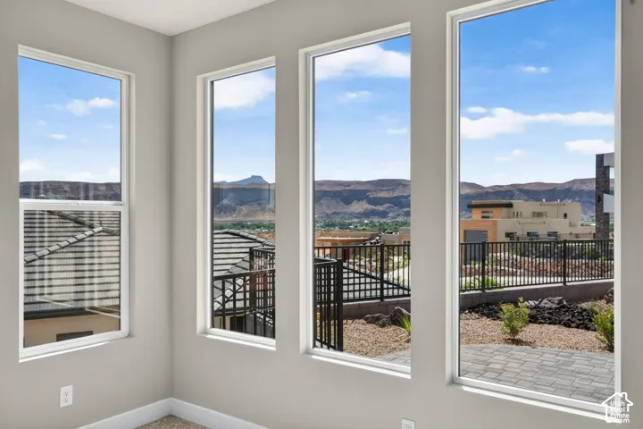 Multiple tall windows with mountain backdrop