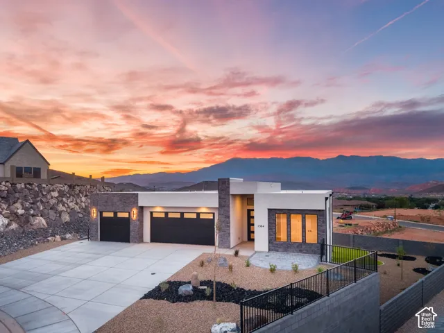 Modern exterior with stone accents and a flat roofline