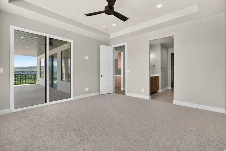 Tray ceiling with recessed lighting and a ceiling fan