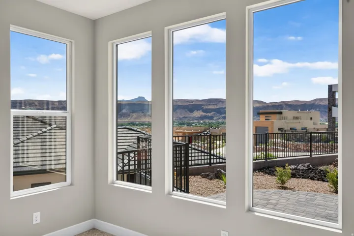 Multiple tall windows with mountain backdrop